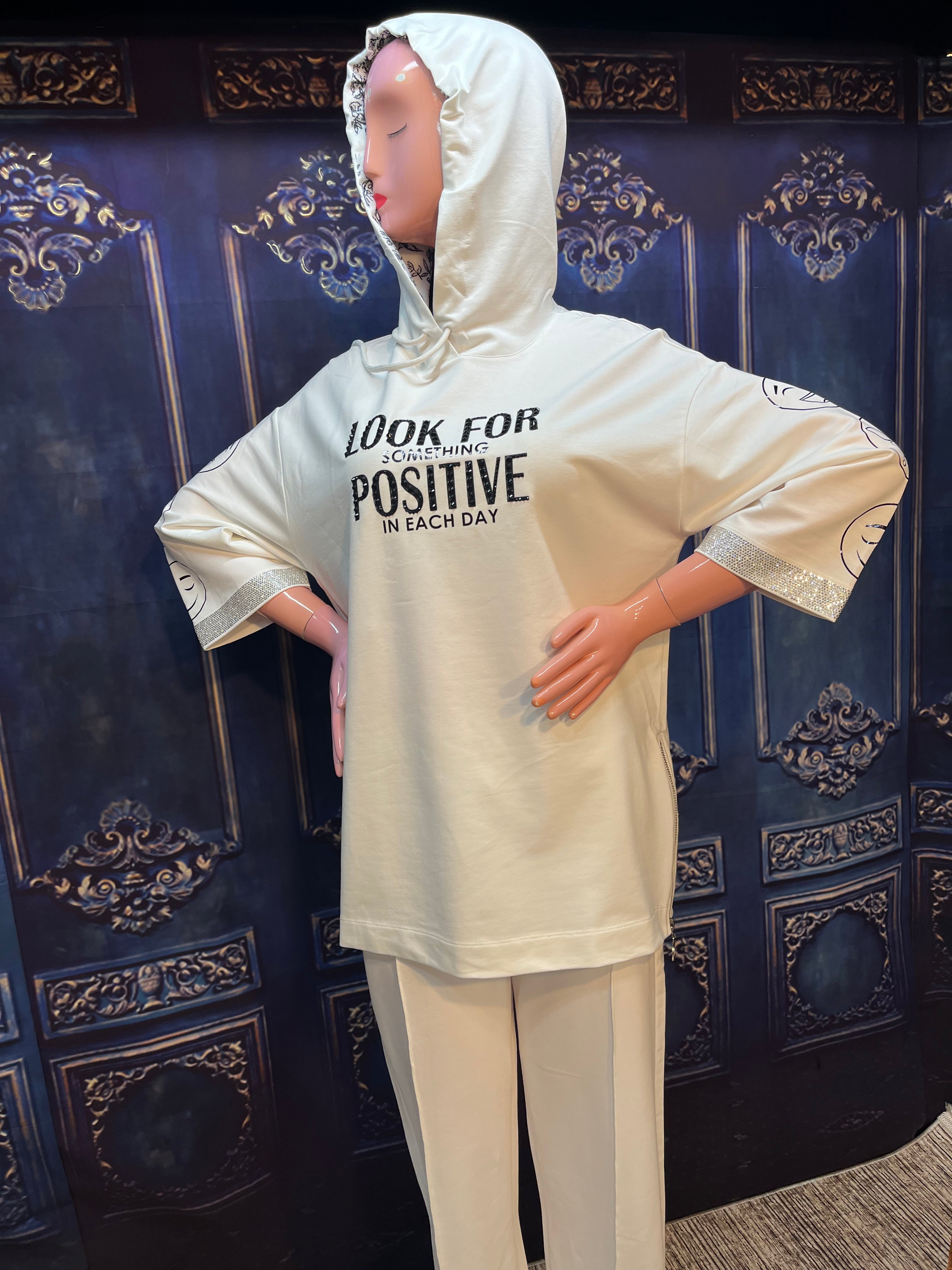 Look for positive woman outfit with hood. Cotton.